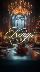 Elegant dining table with chandelier and holiday decor.