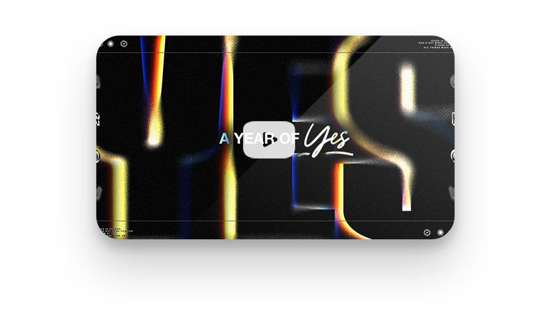 Stylized 'YES' with video play button overlay.